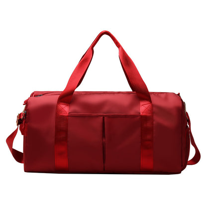 Red duffel bag on a white background